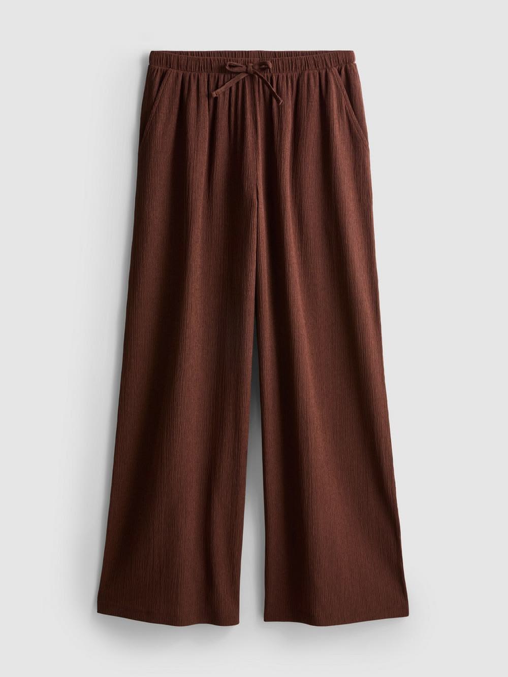 Brown wide-leg pants on a light gray background